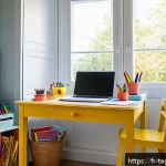 Home 22 홈스쿨링을 위한 여름 방학 계획 - A bright and cozy children’s study nook in a French home, featuring a child-sized wooden desk neatly...